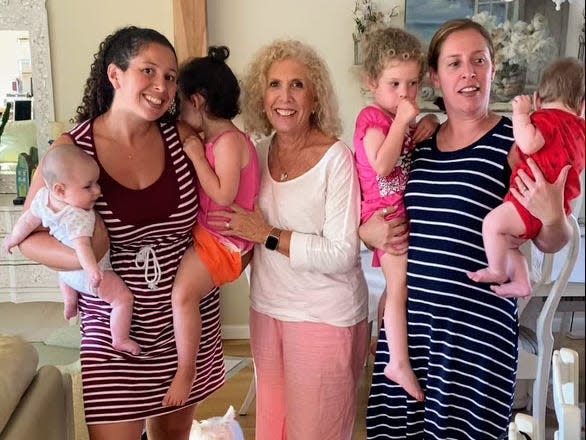 Marjorie Hershberg with her two daughters and four grandchildren.