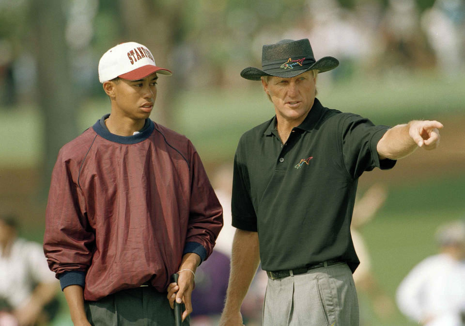 <p>U.S. Amateur Champion Tiger Woods, left, talks with Greg Norman, of Australia, on number two during practice for the 1995 Masters on the Augusta National Golf Club in Augusta, Ga., April 4, 1995. (AP Photo/Dave Martin) </p>