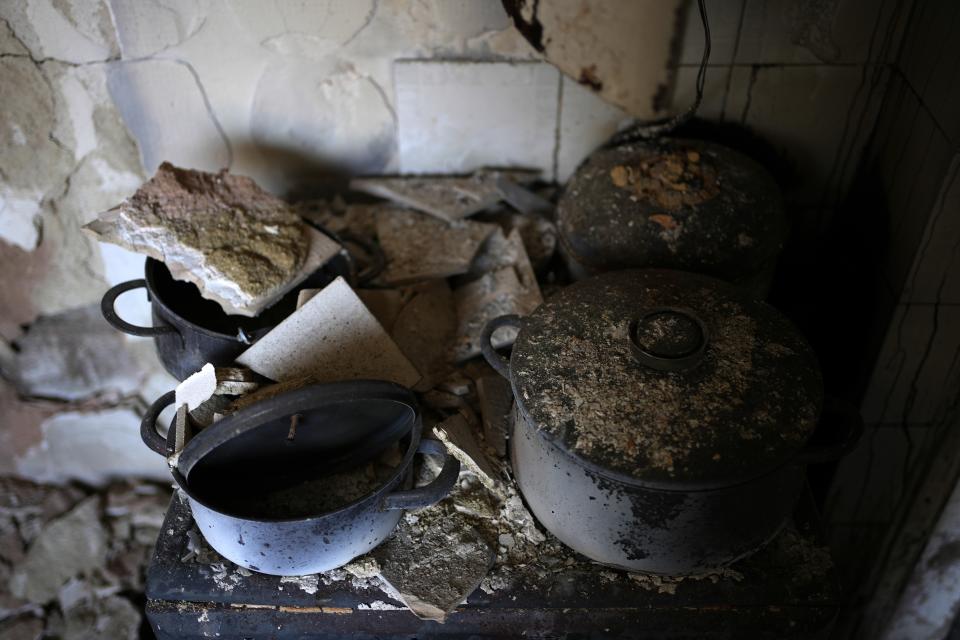 The damaged kitchen of retiree Chrysoula Renieri is seen at her burned out home in Loutraki, about 82 kilometres (51 miles) west of Athens, Greece, Thursday, July 20, 2023. Renieri, 72, was among dozens of people who lost their home in the area as wildfires tore through hillside scrub and forests outside Athens. (AP Photo/Thanassis Stavrakis)