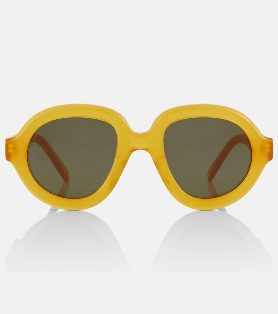 <p><a href="https://go.redirectingat.com?id=74968X1596630&url=https%3A%2F%2Fwww.mytheresa.com%2Fus%2Fen%2Fwomen%2Floewe-round-sunglasses-yellow-p00834294&sref=https%3A%2F%2F" rel="nofollow noopener" target="_blank" data-ylk="slk:Shop Now;elm:context_link;itc:0;sec:content-canvas" class="link ">Shop Now</a></p><p>Round Sunglasses</p><p>mytheresa.com</p><p>$217.00</p>