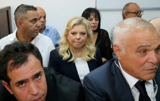 Sara Netanyahu (C), wife of Israeli Prime Minister Benjamin Netanyahu, attends a hearing at a Jerusalem court for allegedly using state funds to fraudulently pay for hundreds of meals