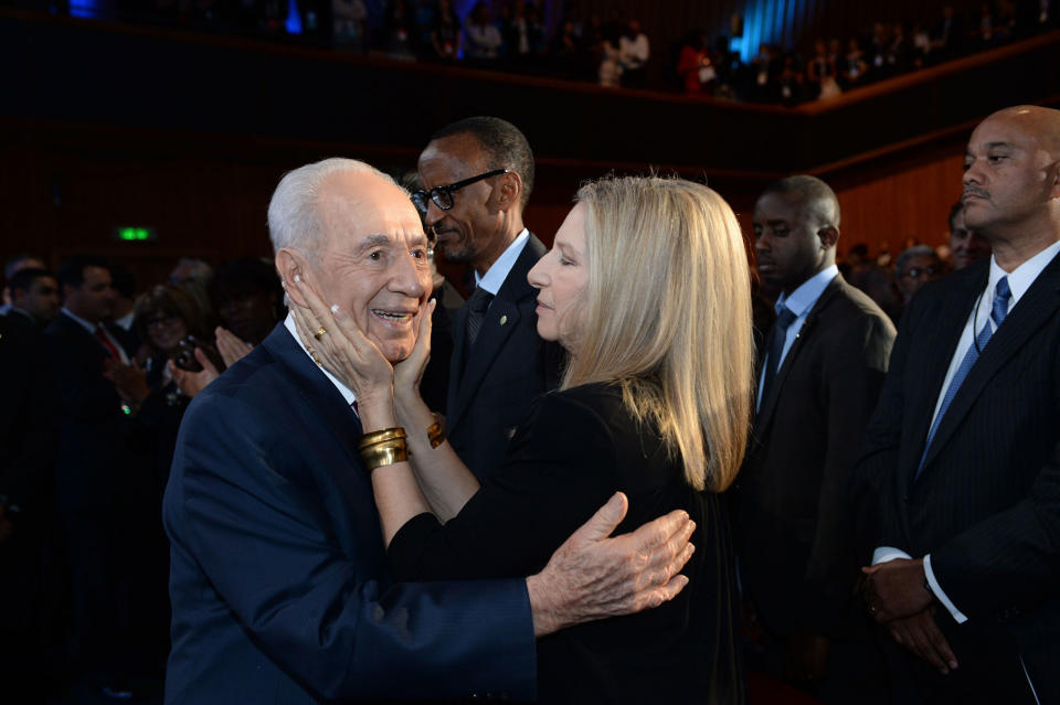 <p>Singer Barbra Streisand hugs Israeli President Shimon Peres attend Peres’ 90th birthday gala June 18, 2013 in Jerusalem, Israel. (Kobi Gideon/GPO via Getty Images) </p>