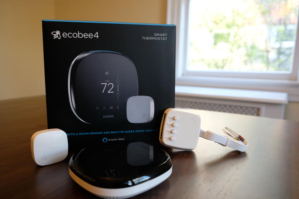 This Sunday, Nov. 11, 2018, photo shows an Ecobee smart thermostat, room sensor and connection components in Hastings-on-Hudson, N.Y. As fall temperatures drop and winter chills loom on the horizon, homeowners and property managers are going beyond traditional winterizing by installing smart thermostats and home energy monitors aiming to lower utility bills. Smart thermostats, which let consumers adjust their home temperatures remotely using any internet-connected device, are among the most popular smart home technologies, with the global smart thermostat market surpassing $1 billion in 2017, according to Research and Markets. (AP Photo/Cathy Bussewitz)