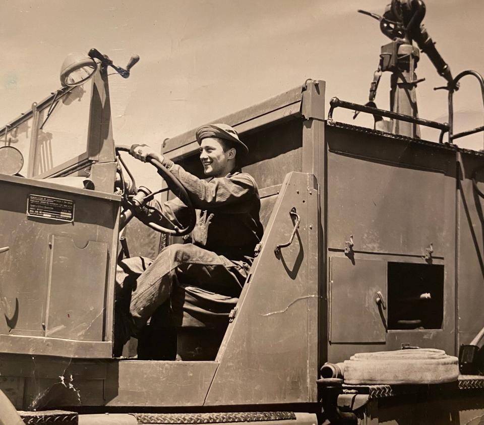Libert Bozzelli behind the wheel of a truck during World War II.