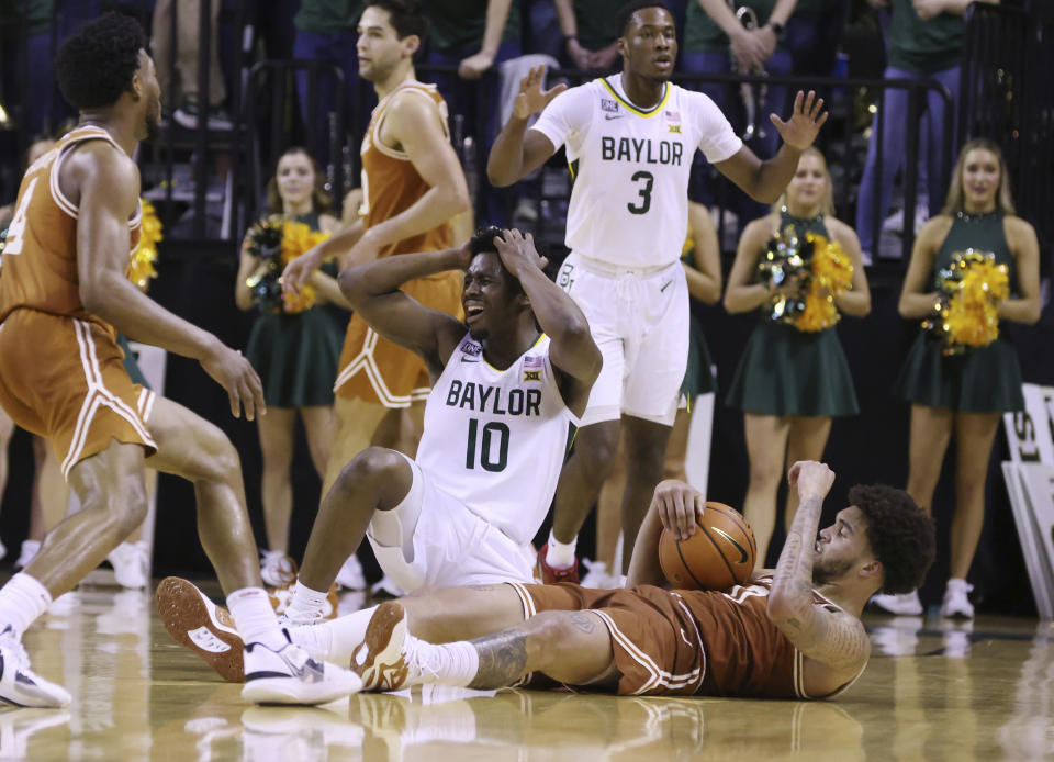 Baylor guard Adam Flagler (10) reacts to his foul on Texas forward Brock Cunningham (30) in the second half of an NCAA college basketball game, Saturday, Feb. 25, 2023, in Waco, Texas. (Rod Aydelotte/Waco Tribune-Herald via AP)