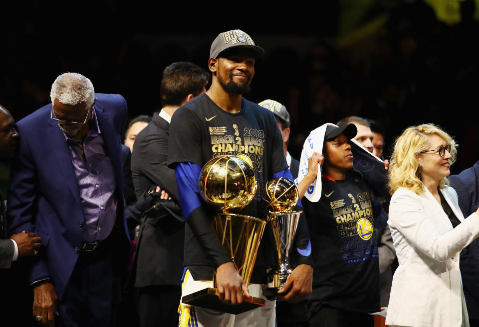 CLEVELAND, OH - JUNE 08:  Kevin Durant #35 of the Golden State Warriors celebrates with the Larry O'Brien Trophy and MVP Trophy after defeating the Cleveland Cavaliers during Game Four of the 2018 NBA Finals at Quicken Loans Arena on June 8, 2018 in Cleveland, Ohio. The Warriors defeated the Cavaliers 108-85 to win the 2018 NBA Finals.  NOTE TO USER: User expressly acknowledges and agrees that, by downloading and or using this photograph, User is consenting to the terms and conditions of the Getty Images License Agreement.  (Photo by Gregory Shamus/Getty Images)