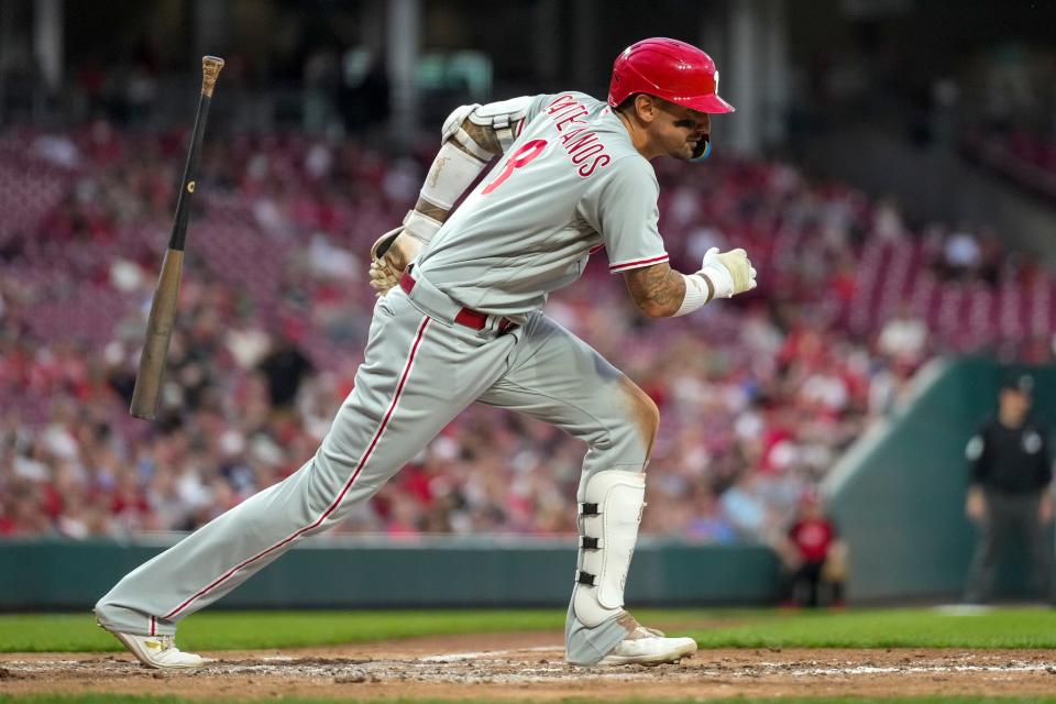 Philadelphia Phillies right fielder Nick Castellanos (8) tosses his bat as he fled out in the fifth inning of the MLB National League game between the Cincinnati Reds and the Philadelphia Phillies at Great American Ball Park in downtown Cincinnati on Friday, April 14, 2023. The Phillies won 8-3.