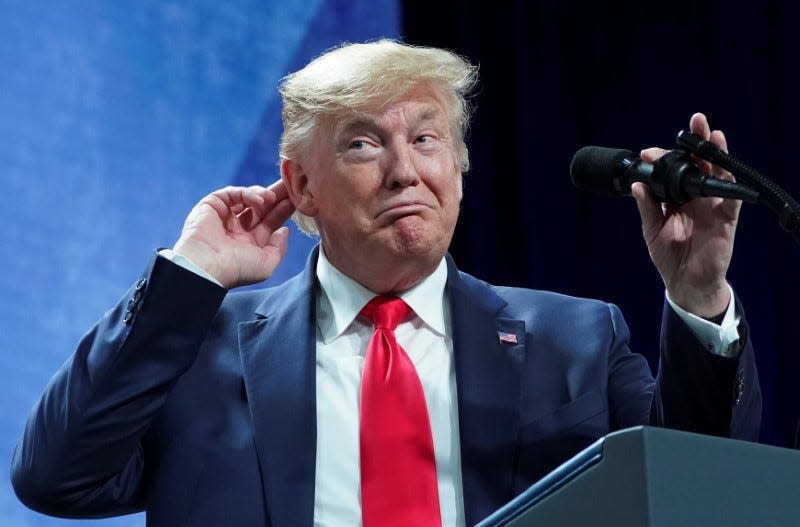 U.S. President Donald Trump  puts his hand to his head while speaking at the American Farm Bureau Federation Annual Convention and Trade Show in Austin, Texas, January 19, 2020. REUTERS/Kevin Lamarque