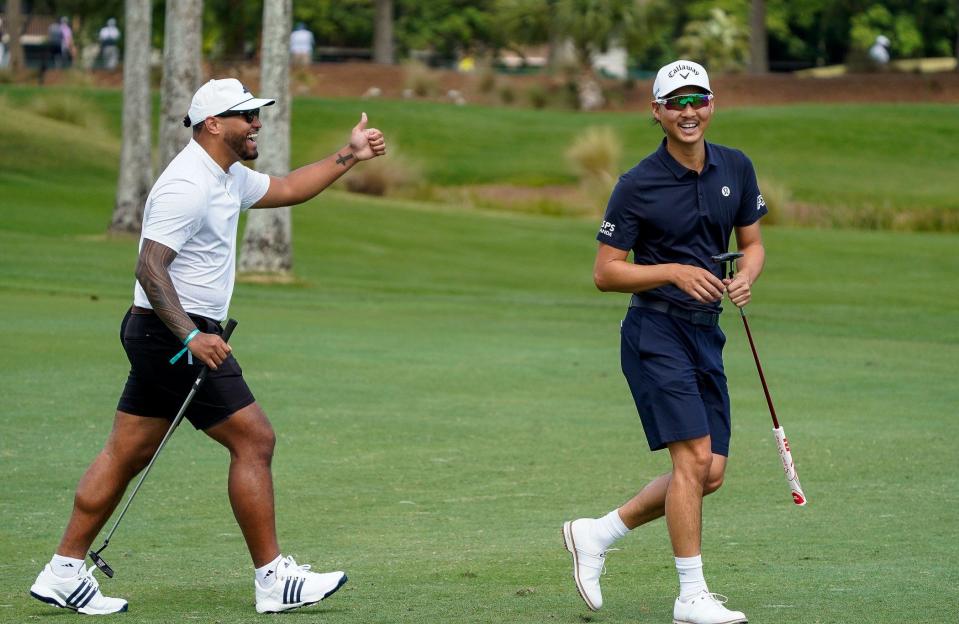 Miami Dolphins quarterback Tua Tagovailoa and Min Woo Lee celebrate a shot during the pro-am of the Cognizant Classic in The Palm Beaches at PGA National Resort & Spa on Wednesday, February 28, 2024, in Palm Beach Gardens, FL.