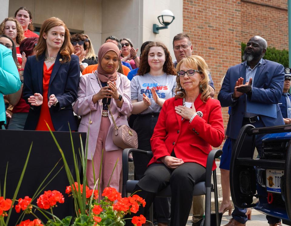 Congresswoman Gabby Giffords reacts after being acknowledged before Michigan Governor Gretchen Whitmer signs into law bills that would allow police officers, family members and medical professionals to ask courts to issue an extreme risk protection order to temporarily take away guns from those who pose a danger to themselves or others on Monday, May 22, 2023, outside of the 44th District Court in Royal Oak.