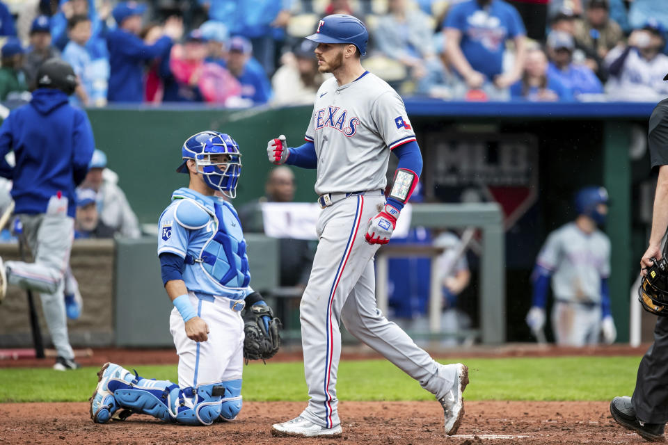 Texas Rangers catcher Jonah Heim reacts after hitting a homer during a baseball game against the Kansas City Royals, Sunday, May 5, 2024, in Kansas City, Mo. (AP Photo/Nick Tre. Smith)