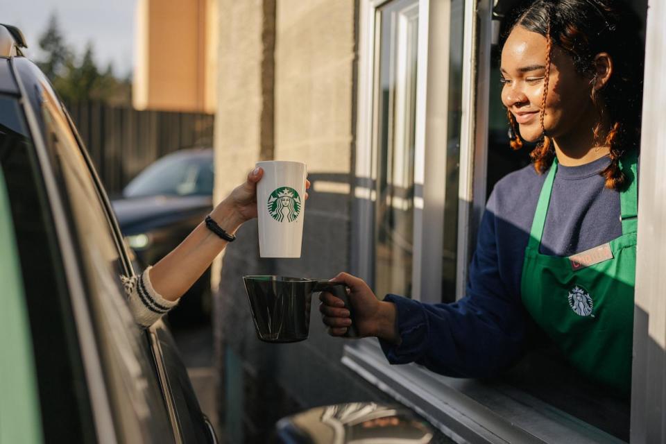 PHOTO: Starbucks customers are able to use their own clean, personal cup for every visit at all company-operated stores and participating licensed stores in the U.S. and Canada – including drive-thru, the Starbucks app, and in café. (Business Wire via AP)