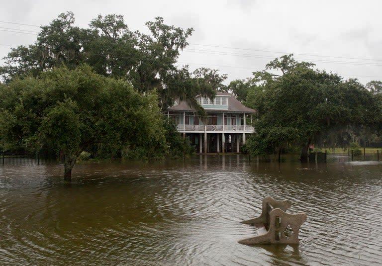 Tropical Storm Barry is dumping rain as it slowly sweeps inland through Gulf Coast states, stoking fears elsewhere of flooding, tornadoes and prolonged power outages. But New Orleans missed the brunt of the storm with forecasters downgrading rainfall estimates for the city through Sunday to between 2 to 4 inches (5 to 10 centimeters). Earlier forecasts of quadruple that amount had raised concerns that water pumps strengthened after Hurricane Katrina would be overwhelmed.Jackson, Mississippi’s capital city, was braced for possible flash flooding, however, after up to 3 inches (7.6cm) of rain fell in the area before dawn on Sunday - with even more precipitation on the way.East of Baton Rouge and in the Mississippi - far from the storm itself - tornado warnings are in place but no serious damage or injuries have yet been reported.President Donald Trump asked people across the region to stay alert, tweeting: "A big risk of major flooding in large parts of Louisiana and all across the Gulf Coast. Please be very careful!" The US National Hurricane Centre said parts of south-central Louisiana could still have rainfall totals of up to 12 inches (30cm), with isolated pockets of 15 inches (38cm), meaning a storm surge is still a threat."This rainfall is expected to lead to dangerous, life-threatening flooding," forecasters wrote in an advisory.On Saturday, Barry flooded motorways in Louisiana, forcing people to scramble onto car rooftops.Coast Guard helicopters rescued a dozen people and two pets from flooded areas of Terrebonne Parish, south of New Orleans. The category one hurricane weakened to a tropical storm shortly after making landfall on Saturday. By Sunday morning the maximum wind speed was 40mph.None of the main levees on the Mississippi River failed or were breached.