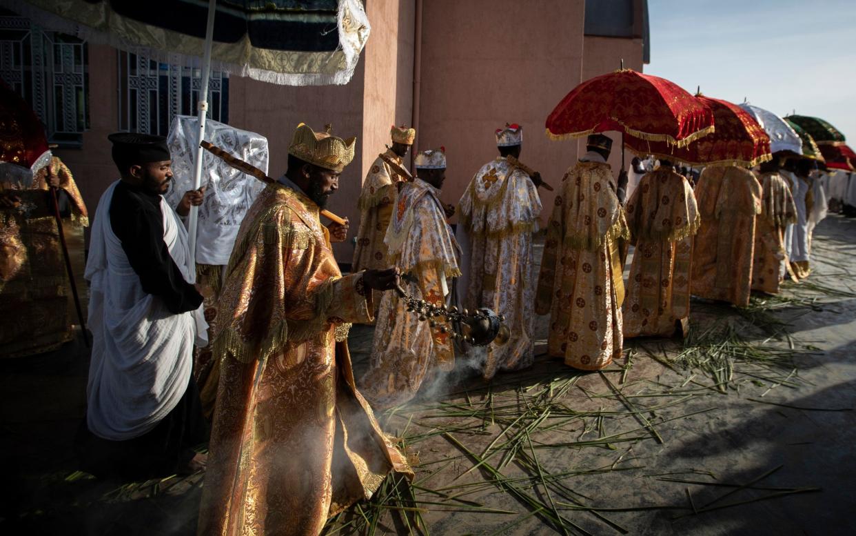 Priests from the Ethiopian Orthodox Tewahedo Church lead the procession during a Sunday morning service at the Church of St. Mary in Mekele, in the Tigray region of northern Ethiopia  - Ben Curtis /AP