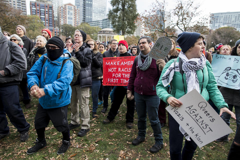 <p>Counterprotesters of an Alt-Right organized free speech event chant and hold up signs on the Boston Common on Nov. 18, 2017, in Boston, Mass. (Photo: Scott Eisen/Getty Images) </p>