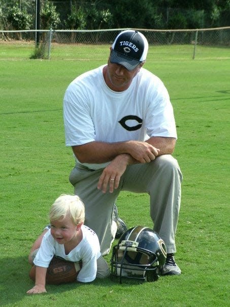 Sammy Brown (left) with his dad, Michael, on picture day at Commerce (Ga.) High School.