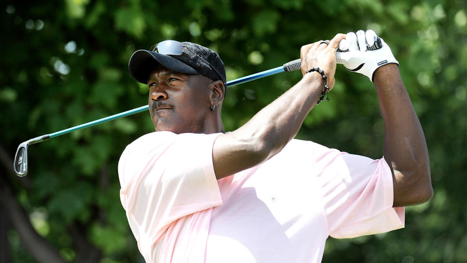 Michael Jordan playing golf.