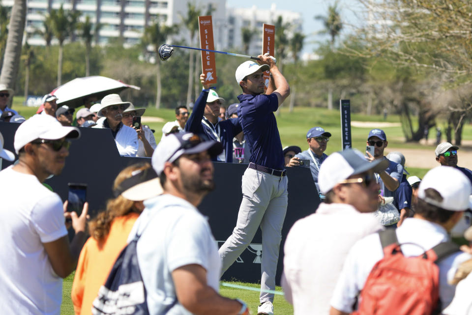 Alvaro Ortiz, of Mexico, watches his tee shot on the second hole during the third round of the Mexico Open golf tournament in Puerto Vallarta, Mexico, Saturday, Feb. 24, 2024. (AP Photo/Fernando Llano)