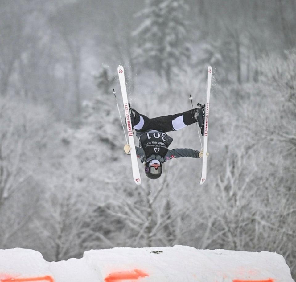 Eden Kruger performs an aerial stunt during her mogul ski run at the U.S. Freestyle Junior Nationals in Steamboat, Colorado.