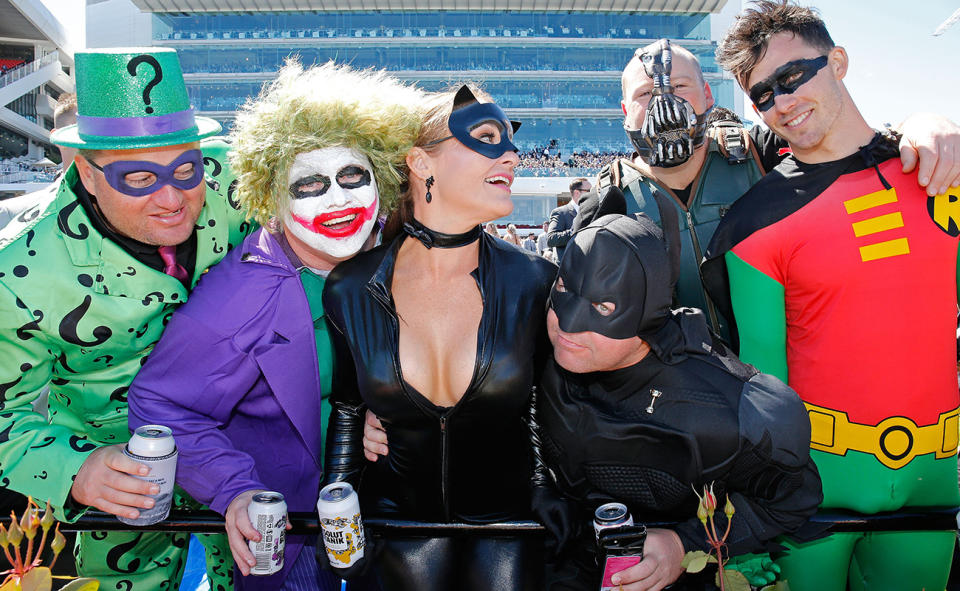 Racegoers, pictured here dressed as superheroes and villains enjoy Derby Day at Flemington Racecourse in 2017. 