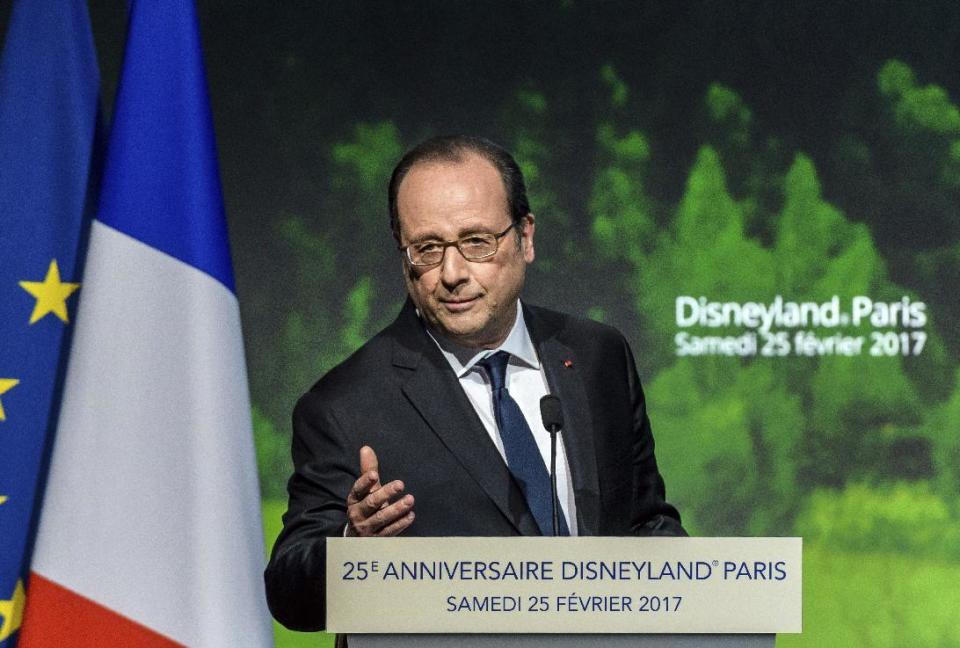 French President Francois Hollande delivers a speech as he visits the Disneyland Paris theme parks in Marne-la-Vallee, north of Paris, Saturday Feb.25, 2017. French President Francois Hollande visits Disneyland Paris to mark its 25th anniversary, as Europe's most popular tourist attraction struggles with long-running financial challenges. (Christophe Petit Tesson/Pool photo via AP)