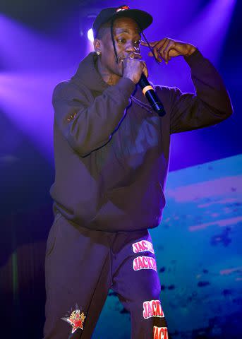 <p>Alexander Tamargo/Getty</p> Travis Scott performs in Miami in December 2023