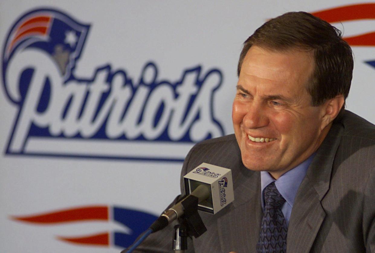 New England Patriots head coach Bill Belichick addresses questions about the upcoming NFL draft during a news conference at Foxboro Stadium in April, 2000.