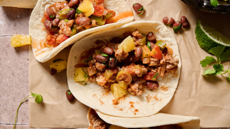 picadillo tacos on a table