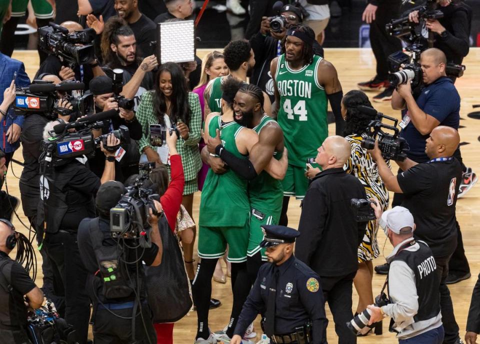 Boston Celtics guards Jaylen Brown (7) and Derrick White (9) celebrate after defeating the Miami Heat 104 to 103 in Game 6 of the NBA Eastern Conference Finals at the Kaseya Center on Saturday, May 27, 2023, in downtown Miami, Fla.