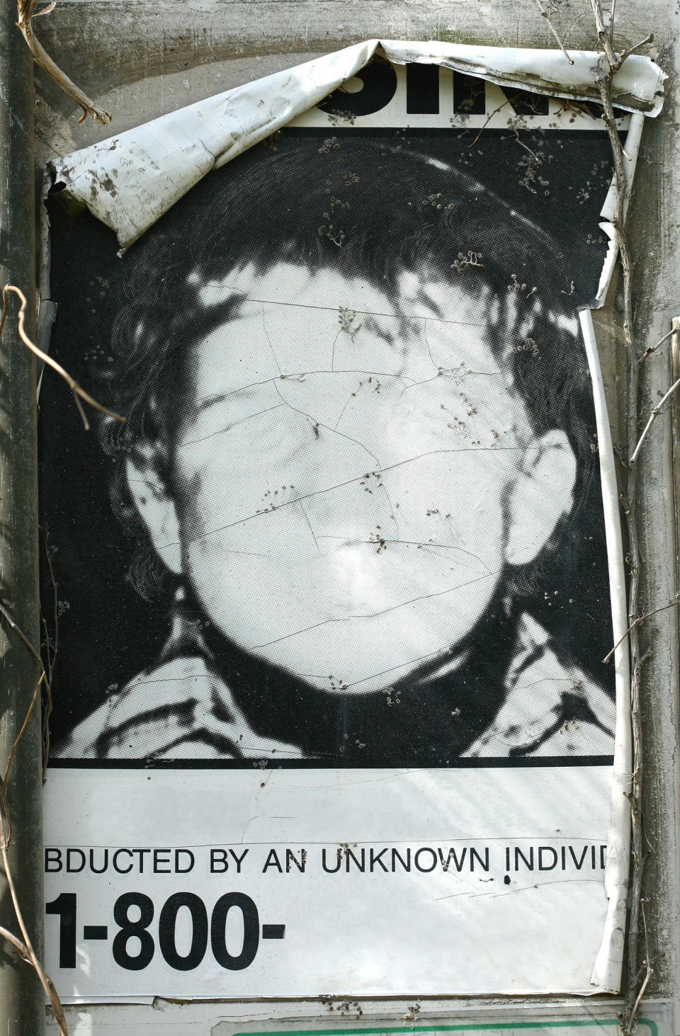 A faceless child with the text "Abducted by an unknown individual"