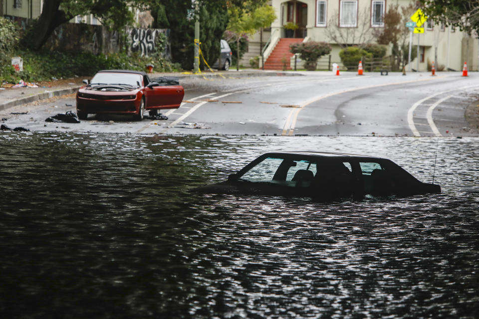 FILE - Cars sit stuck in a flooded underpass in Oakland, Calif., on, Jan. 4, 2023. The series of storms that have struck California have poured water on a state mired in a years-long drought. Experts say the precipitation will help relieve the drought somewhat. (Salgu Wissmath/San Francisco Chronicle via AP, File)