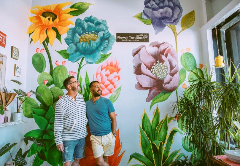 Robert Lavia-Garcia and Jeff Lavia-Garcia inside of their plant shop 'Flower Tortillas' on Saturday, August 12, 2023 in San Pedro, CA. (Kendra Frankle / For The Times)