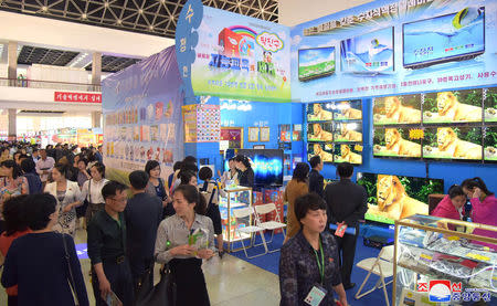 People attend the 22nd Pyongyang Spring International Trade Fair, in Pyongyang, North Korea May 20, 2019. KCNA via REUTERS