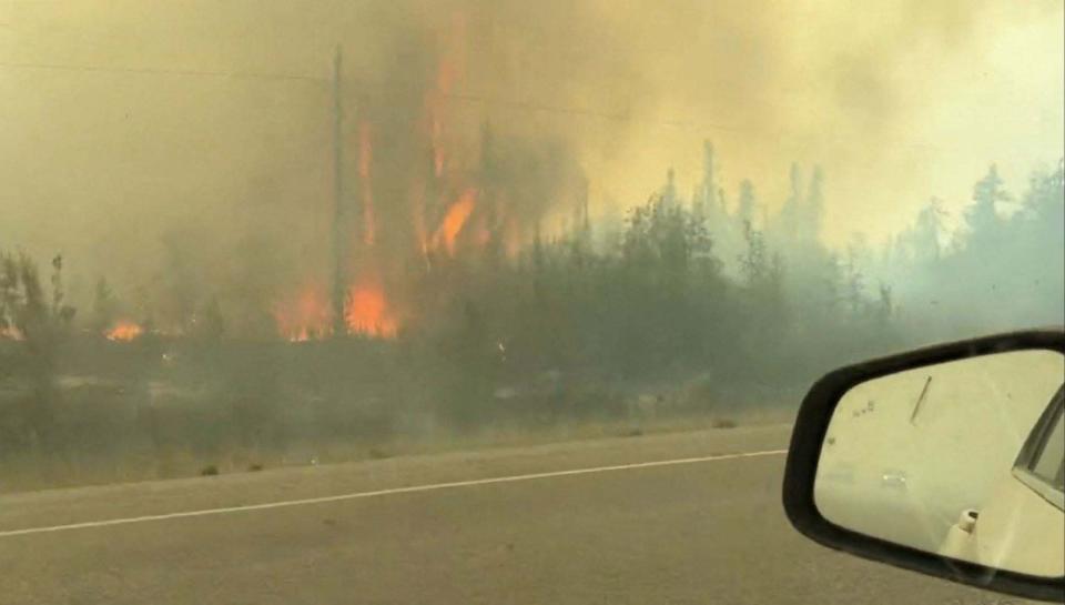 PHOTO: This screengrab from a video provided by Jordan Straker shows vehicles driving on the freeway as people evacuate from Yellowkife, Northwest Territories, Canada, on Aug. 16, 2023. (Jordan Straker/UGC via AFP via Getty Images)