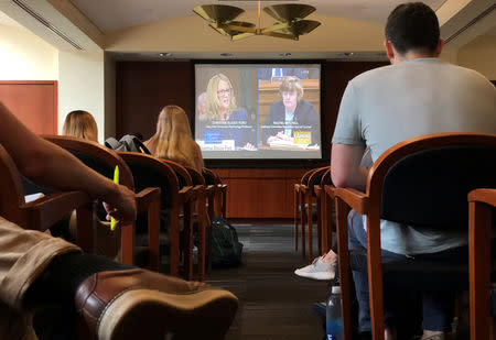 Students of the George Washington University Law School gather at Lisner Hall to watch the U.S. Senate Supreme Court confirmation hearing into sexual assault allegations from Christine Blasey Ford against Supreme Court nominee Judge Brett M. Kavanaugh in Washington, DC, U.S. September 27, 2018. REUTERS/Kevin Fogarty