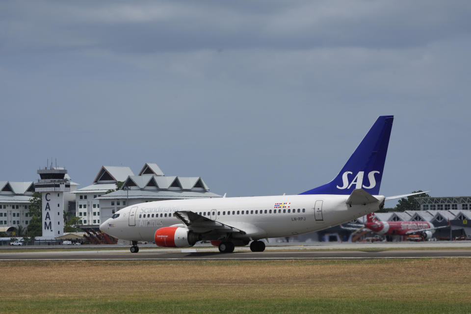 A Scandinavian Airlines medevac plane, believed to be carrying Norway's King Harald, is seen at Langkawi international airport on the Malaysian resort island of Langkawi, Malaysia, Sunday, March 3, 2024. An airplane believed to be carrying Norway’s King Harald departed Malaysia on Sunday, a day after he was implanted with a pacemaker. (AP Photo/Vincent Thian)