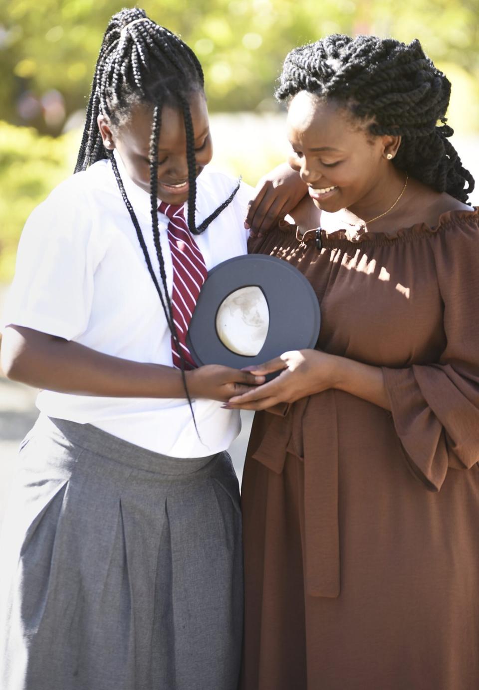 Charlot Magayi, Founder of Mukuru Clean Stoves with her daughter