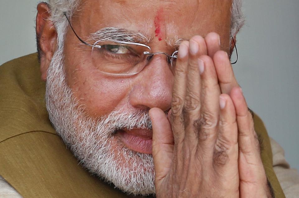 FILE - Opposition Bharatiya Janata Party (BJP) leader and India's next prime minister Narendra Modi greets the gathering at the home of his 90-year-old mother in Gandhinagar, in the western Indian state of Gujarat, Friday, May 16, 2014. Modi won the most decisive election victory the country has seen in more than a quarter century and swept the long-dominant Congress party from power. (AP Photo/Saurabh Das, File)