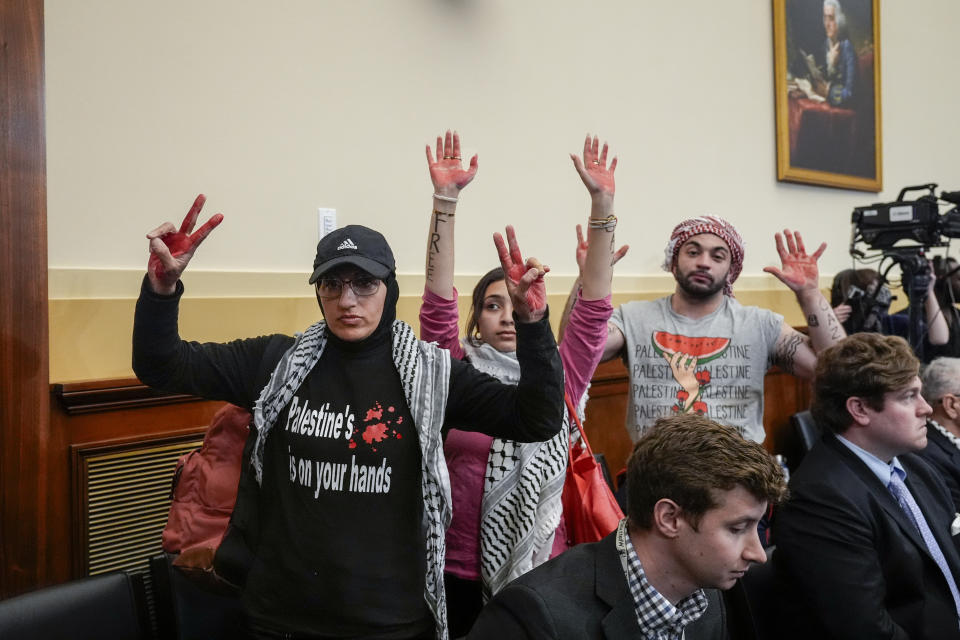 Activists supporting Palestinians in Gaza demonstrate as they leave a House Foreign Affairs Committee hearing on the U.S. withdrawal from Afghanistan, at the Capitol in Washington, Tuesday, March 19, 2024. (AP Photo/J. Scott Applewhite)