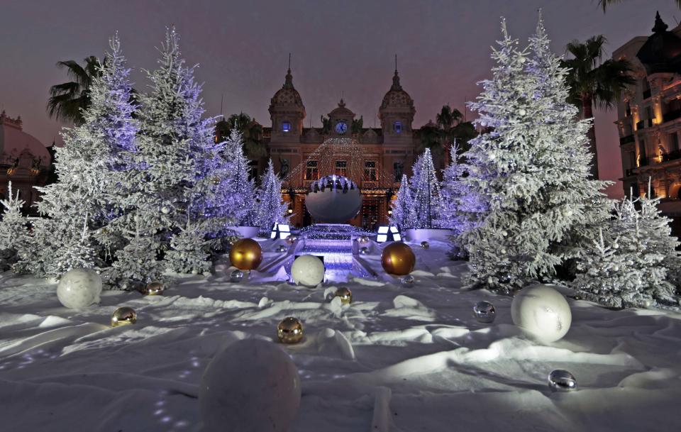 Christmas trees frame the Monte Carlo Casino as part of holiday season decorations in Monaco December 13, 2013 . REUTERS/Eric Gaillard (MONACO - Tags: SOCIETY TRAVEL)