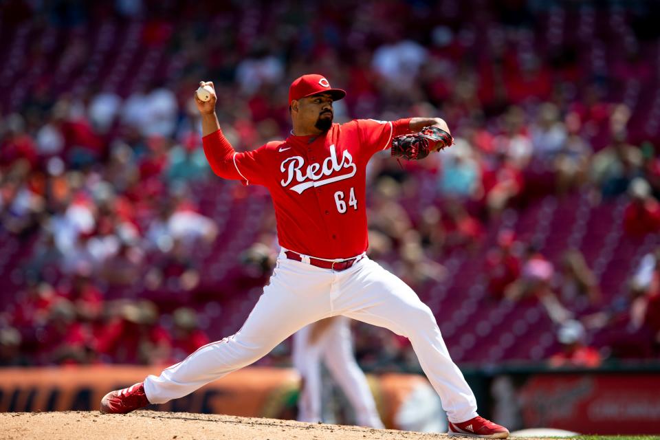 Cincinnati Reds relief pitcher Tony Santillan (64) pitches in the ninth inning of the MLB game between the Cincinnati Reds and the Arizona Diamondbacks at Great American Ball Park in Cincinnati on Thursday, June 9, 2022.