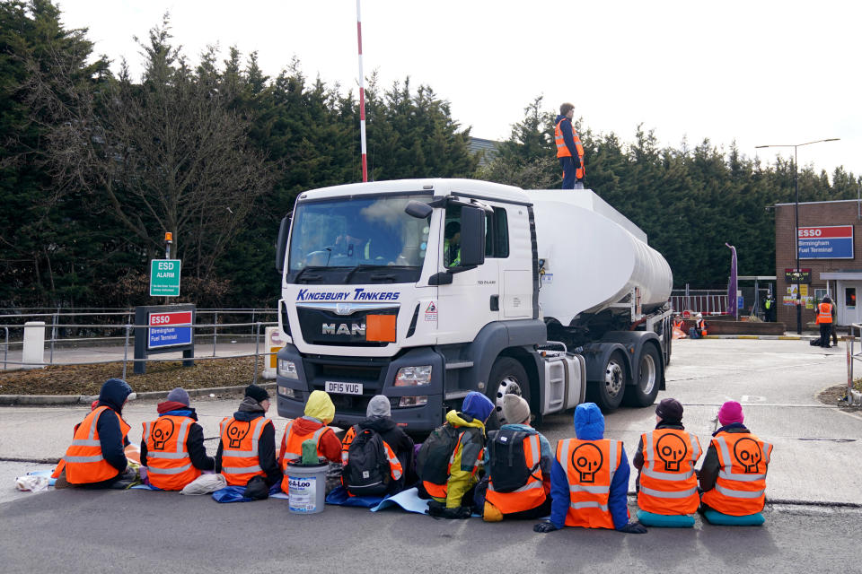 Activists from Just Stop Oil block the route of a tanker as they blockade the ESSO Birmingham Fuel Terminal, Birmingham. Picture date: Friday April 1, 2022. (Photo by Joe Giddens/PA Images via Getty Images)