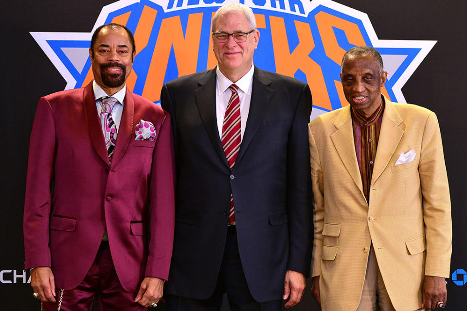 Walt Frazier (L) with Dick Barnett (R) and Phil Jackson in 2014. - Credit: James Devaney/WireImage