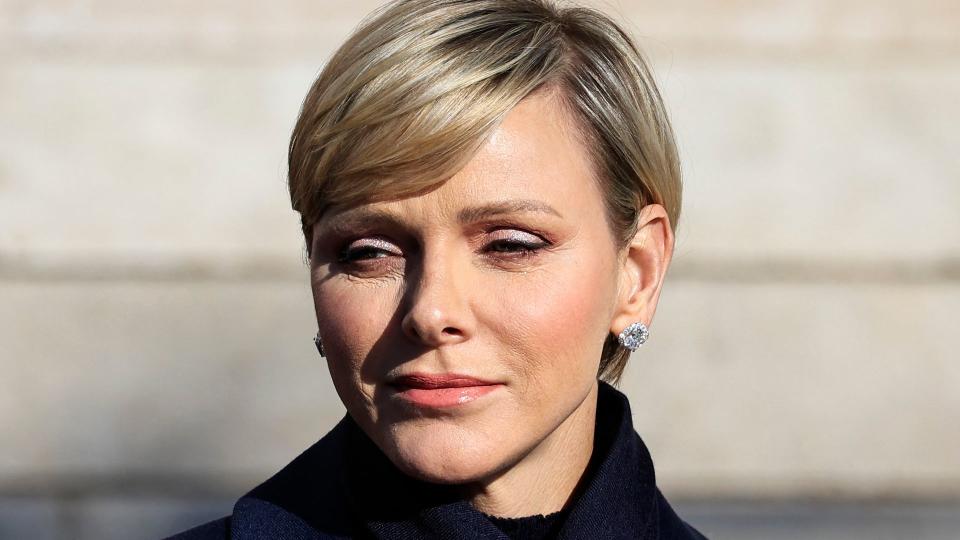 Princess Charlene standing in sunshine 