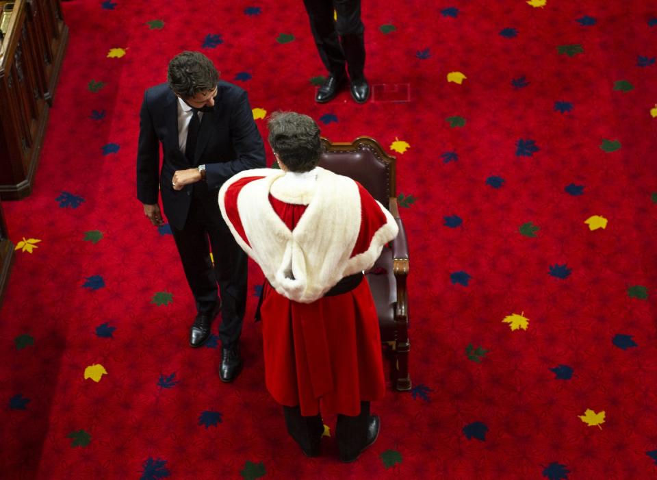 Prime Minister Justin Trudeau greets Richard Wagner, Chief Justice of the Supreme Court of Canada, with an elbow bump at the delivery of the Speech from the Throne in September 2020. THE CANADIAN PRESS/Justin Tang