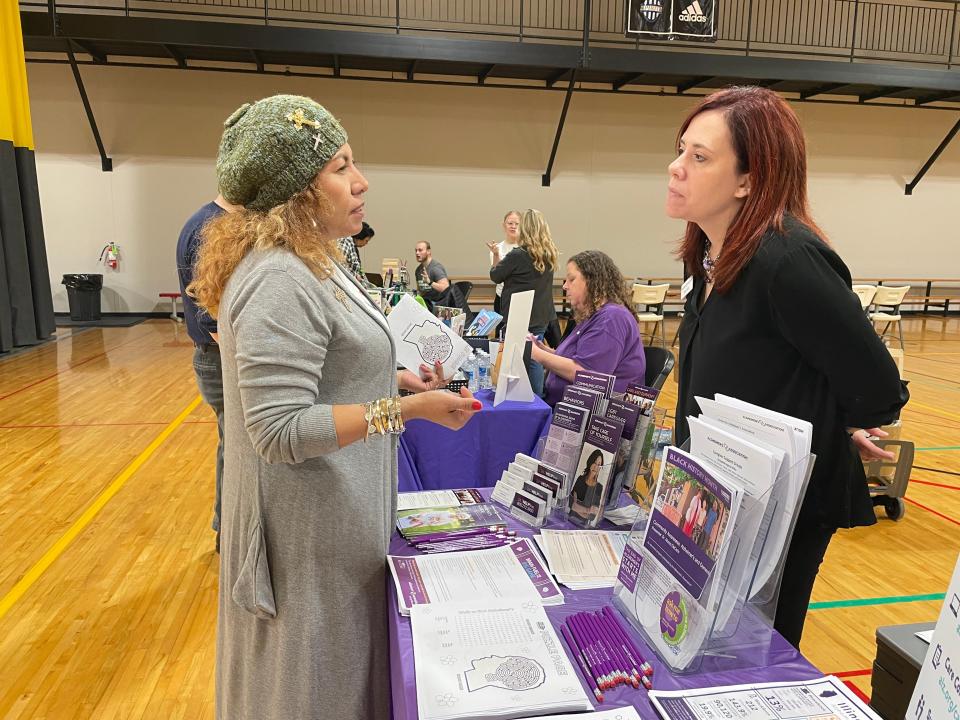 Ana Manriquez, left, and Stacy Kelly of the Springfield office of the Alzheimer's Association chat it up Saturday, Jan. 28, 2023 at the Downtown Kiwanis Kidsbash at the Salvation Army.