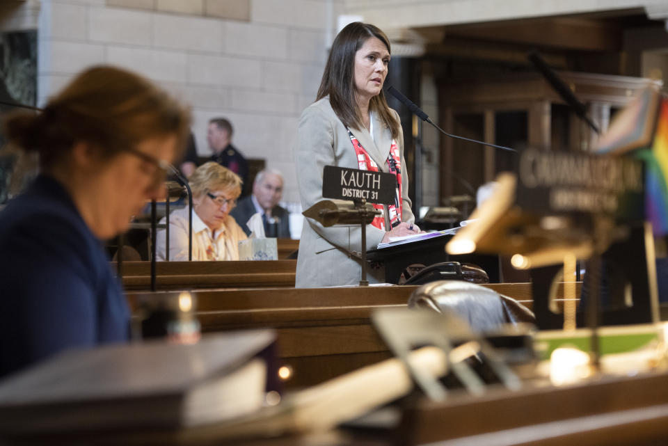 FILE - Nebraska Sen. Kathleen Kauth of Omaha speaks during the final reading of LB574, which limits gender-affirming care for trans youth, May 19, 2023, in Lincoln, Neb. Regulations tied to a Nebraska law passed in 2023 restricting gender-affirming care for minors were approved Tuesday, March 12, 2024, by Gov. Jim Pillen, and they largely mirror temporary regulations adopted last October — including a seven-day waiting period to start puberty blocking medications or hormone treatments. (Justin Wan/Lincoln Journal Star via AP, File)
