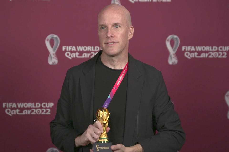 A screenshot taken from video provided by FIFA of journalist Grant Wahl at an awards ceremony in Doha, Qatar in Nov. 2022. Wahl, one of the most well-known soccer writers in the United States, died early Saturday Dec. 10, 2022 while covering the World Cup match between Argentina and the Netherlands. (FIFA via AP)