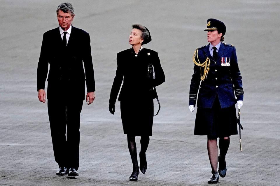 Princess Anne, Princess Royal and Timothy Laurence arrive by plane after travelling with the coffin of Queen Elizabeth II to RAF Northolt, west London, from where it will be taken to Buckingham Palace, London, to lie at rest overnight in the Bow Room on September 13, 2022 in London, England.