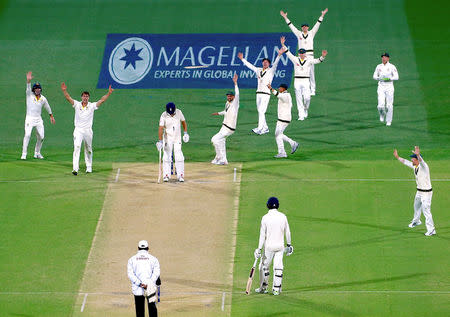 Cricket - Ashes test match - Australia v England - Adelaide Oval, Adelaide, Australia, December 3, 2017 - Australia's Pat Cummins appeals with team mates unsuccessfully for the wicket of England's Alastair Cook during the second day of the second Ashes cricket test match. REUTERS/David Gray